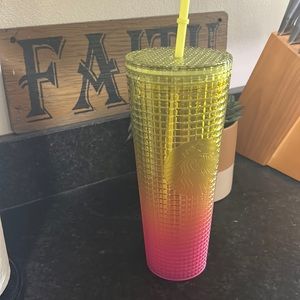 Yellow and pink venti Starbucks cup